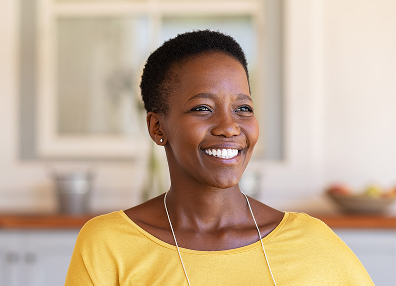 Very nice lady smiling wearing a yellow shirt