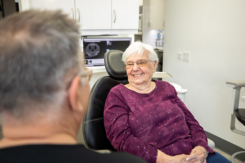 Very nice patient smiling at Dr. Wolf